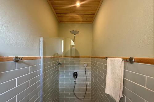 a bathroom with a shower with a phone in it at With the comfort of home in Kemer