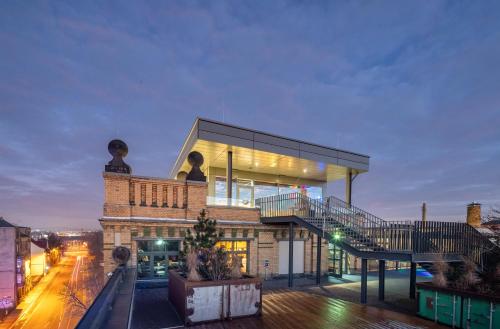 a house on top of a building at fabrik studio apartments in Chemnitz