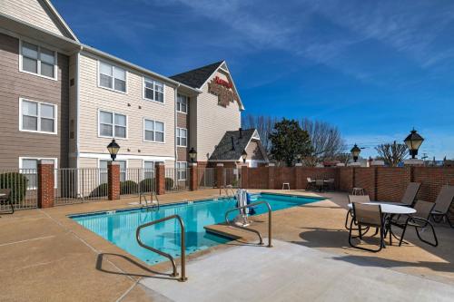 a swimming pool in front of a building at Residence Inn Shreveport Airport in Shreveport