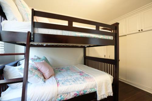 a bedroom with two bunk beds with a bed at Destination #22 in Anaheim