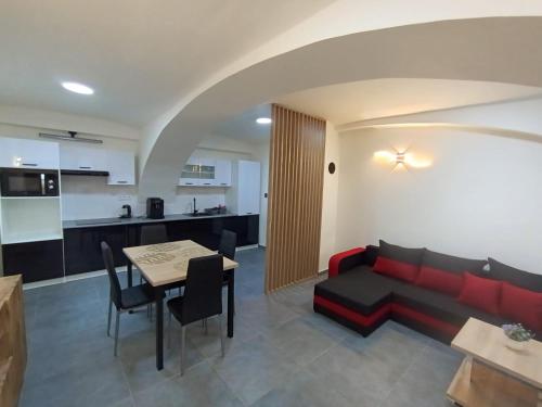 a living room with a couch and a table at Apartmány Sebastian in Golčŭv Jeníkov
