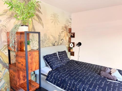 Postel nebo postele na pokoji v ubytování L'escale de Haguenau - Cosy dans le centre Haguenau