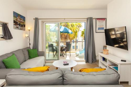 a living room with a couch and a table at B06 - Top-Floor Marina 2 Bed Apartment in Lagos