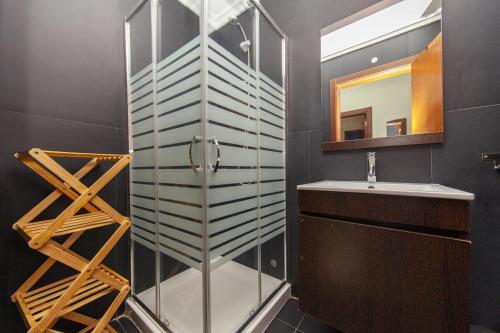a bathroom with a glass shower and a sink at B03 - Luxury 2 Bed near Lagos Marina in Lagos