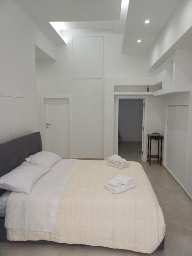 Una cama o camas en una habitación de Dimora Marte