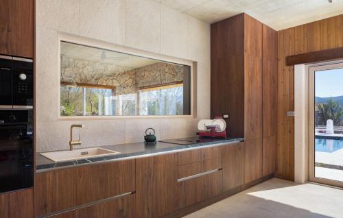 a kitchen with a sink and a window at Villa Fantazija - Split by Villas Guide in Klanac