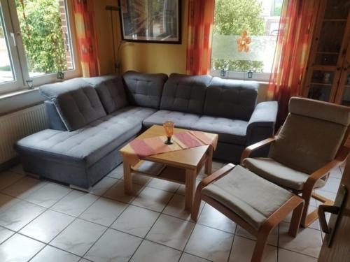 a living room with a couch and a coffee table at Waldwiese RE15 in Sögel