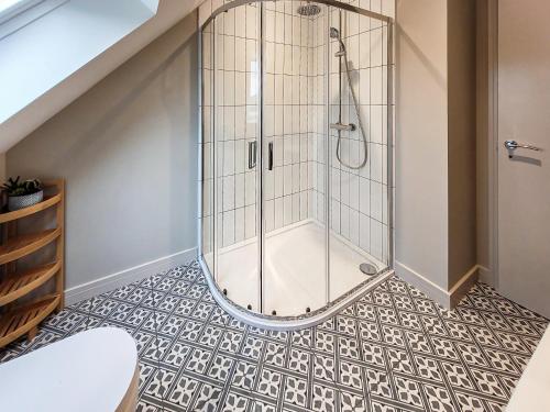 a shower in a bathroom with a tile floor at Bramley Lodge - Uk47874 in Tortworth