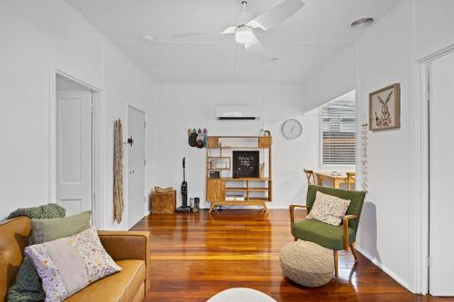 a living room with a couch and two chairs at Salt & Soul - A Sepal Stay in South Fremantle
