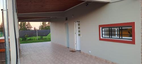 an empty hallway of a building with a window at Comoda quinta en El Pato in El Pato