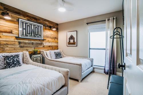 a bedroom with two beds and a window at The McKinney Luxury Escape Close to Everything! in McKinney