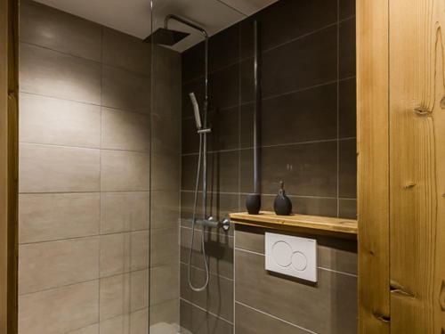 a bathroom with a shower with a shower head at Charme et Confort au Centre de Val d'Isère – 2 Pièces Cabine Rénové pour 5 Pers., Proche Pistes - FR-1-518-25 in Val dʼIsère