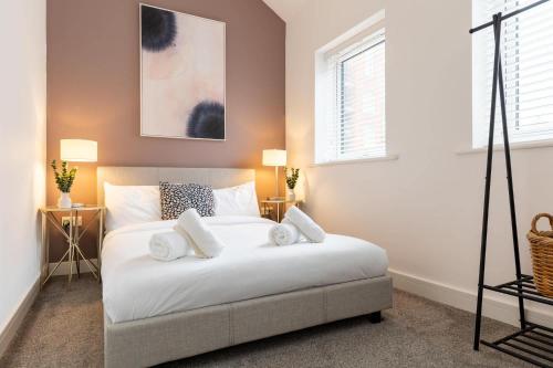 En eller flere senge i et værelse på Welton View Coastal Escape