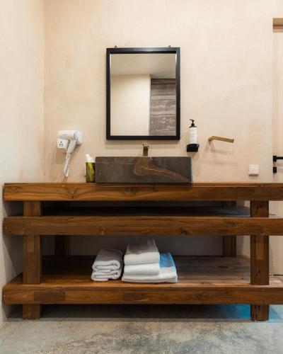 a bathroom counter with a sink and a mirror at Nekresi Estate in Kvareli