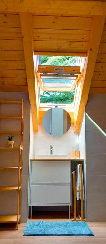 a kitchen with a sink and a skylight at Adda River Tower Room in Calolziocorte
