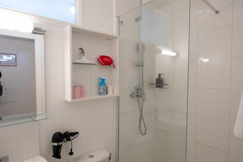 a bathroom with a shower with a glass door at Studio number 7 in Pantin