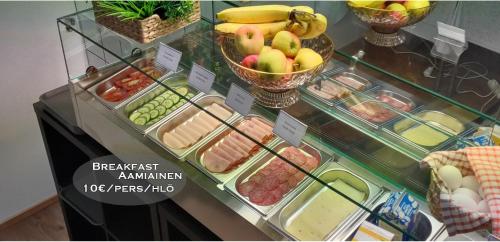 a display case in a store with fruits and vegetables at Hotel 24 - Karihaara - Kemi in Kemi