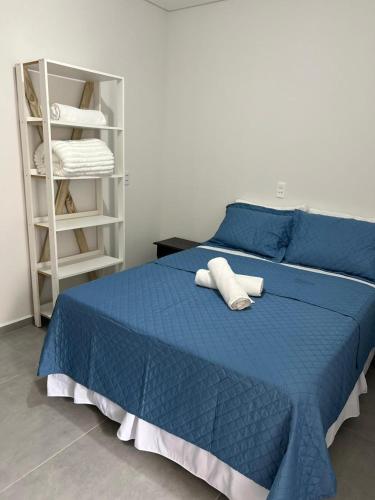 Ένα ή περισσότερα κρεβάτια σε δωμάτιο στο Residencial da Ju - Apto 02