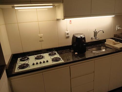 Una cocina o cocineta en Casa Completa Aconchegante e Decorada