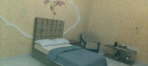 Ένα ή περισσότερα κρεβάτια σε δωμάτιο στο HOUSE IN AL AIN