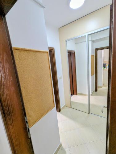 a door leading into a hallway with a mirror at Lihnidos Home, Central Stay, Wi-Fi, near Lake, AC in Ohrid