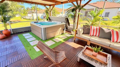 a hot tub on the patio of a house at Spacious 5BR Private Home, Private Pool & Salt Water Spa, Minutes from Beaches in Bradenton