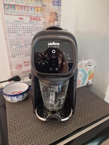a blender sitting on top of a shelf at B&B La Riva del Po Camera indipendente in Turin