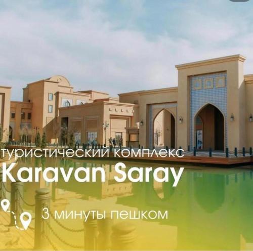 a picture of a mosque with a sign that reads karavanavan saray at Keruen Saray Apartaments 1 in Türkistan