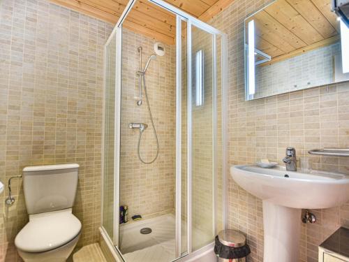 a bathroom with a shower and a toilet and a sink at Spacieux T4 proche des pistes avec terrasse et parking - 6-8 pers. - FR-1-685-22 in Les Gets
