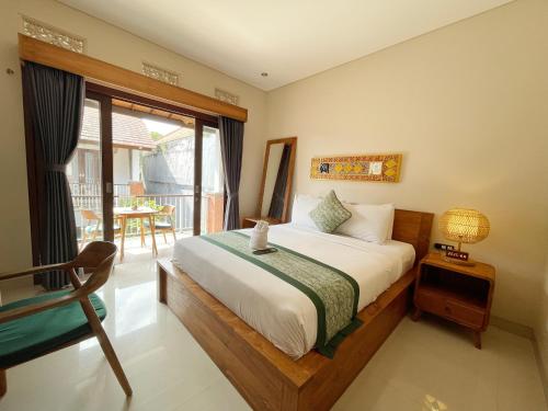 Postel nebo postele na pokoji v ubytování Arumasta Ubud