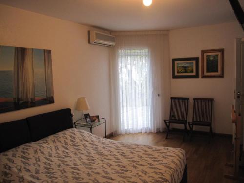 Ένα ή περισσότερα κρεβάτια σε δωμάτιο στο Villa Itati