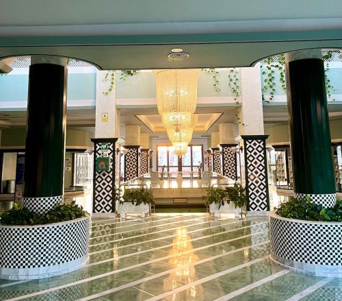 a lobby of a hotel with a chandelier at Bonito in Adeje