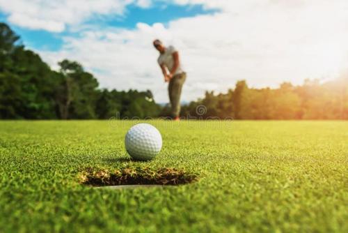 a man standing next to a golf ball on a field at Superbe ! Riad ALBAYDA Suite & Rooftop in Essaouira