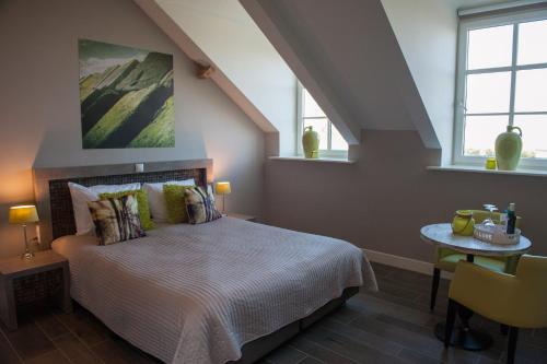 Letto o letti in una camera di Hof van Alexander Boutiquehotel