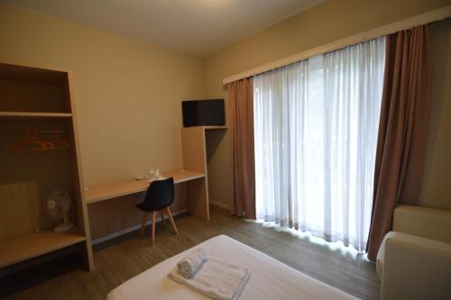 a hotel room with a bed and a large window at Budget Flats Brussels in Brussels