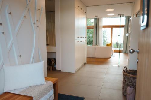 a hallway of a house with a bathroom and a tub at Campingbeach Ossiacher See in Annenheim