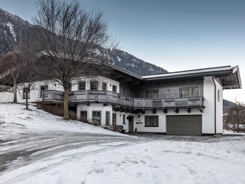 a house in the snow with a driveway at Chalet Pirchhof inklusive Sauna in Sautens