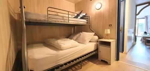 En eller flere senge i et værelse på Le Ptit Vertbois