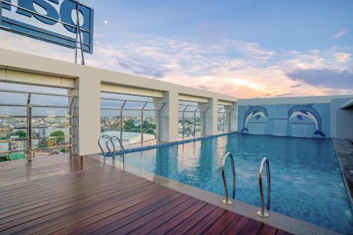 a swimming pool in a building with a view at Park Inn by Radisson Lucknow Vikas Nagar in Lucknow