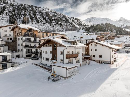 a group of buildings in the snow at Chalet Cecilia inklusive Spa- Area in Obergurgl