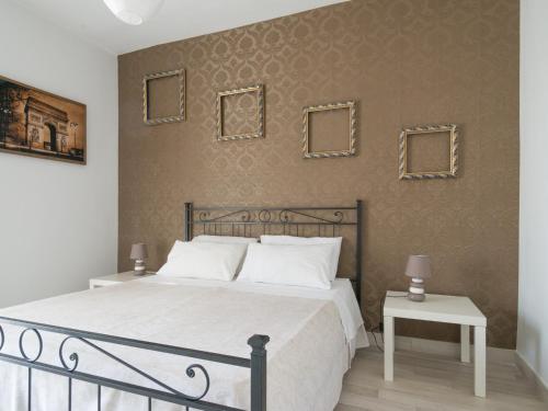 מיטה או מיטות בחדר ב-Casa Castel Capuano