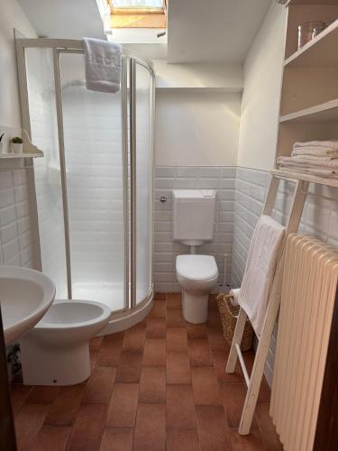 a bathroom with a shower and a toilet and a sink at La Fattoria in Santarcangelo di Romagna