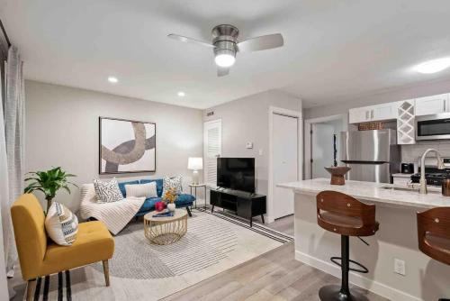 a living room with a kitchen and a living room with a couch at Steps away from Downtown Restaurants and Bars - King Bed in Austin