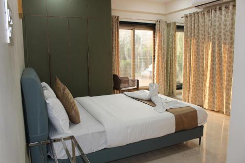 Ένα ή περισσότερα κρεβάτια σε δωμάτιο στο Black Buck Homestay