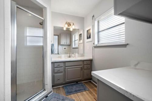 a bathroom with a shower and a sink at Secluded beachfront house with gorgeous ocean views in Galveston