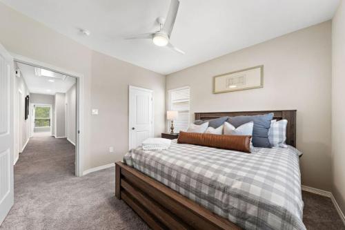 a bedroom with a large bed in a room at Beautiful home with lake views and in-ground pool in West Livingston