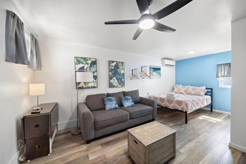 a living room with a couch and a bed at Cozy ocean view condo on Galvestons east end, close to cruise terminal in Galveston