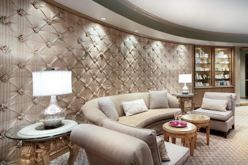 a living room with a couch and chairs at The San Luis Resort Spa & Conference Center in Galveston