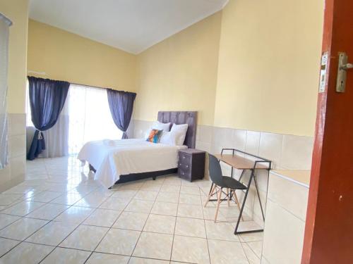 Postel nebo postele na pokoji v ubytování Cosy Retreat