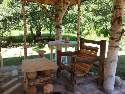 a table and two chairs under a gazebo at Staparski Sorrento in Užice